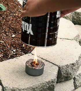 6. When you’re ready to cook, light the wick and set the coffee can over the wax-filled tuna can.