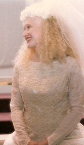 While Aimee would have been happy with the plain silk dress, the embellishments Jennifer added not only increased its beauty, but they also helped hide where it had been altered.