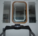 Flanking an oak-framed mirror, the medicine-cabinet doors minimize feelings of claustrophobia when I’m on the treadmill.