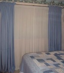 It cost only $3 total to make both of the blue curtain panels. For that price, I can put up with seams near the bottom of each panel.