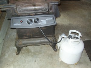 : The barbecue’s controls are mounted on the side of the stove. Eventually, Carmen will hook it up to a regular propane line instead of the portable tank.