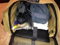 This carrier, with Joyce's purse, jacket, liquids bag, and laptop, goes in the overhead bin.